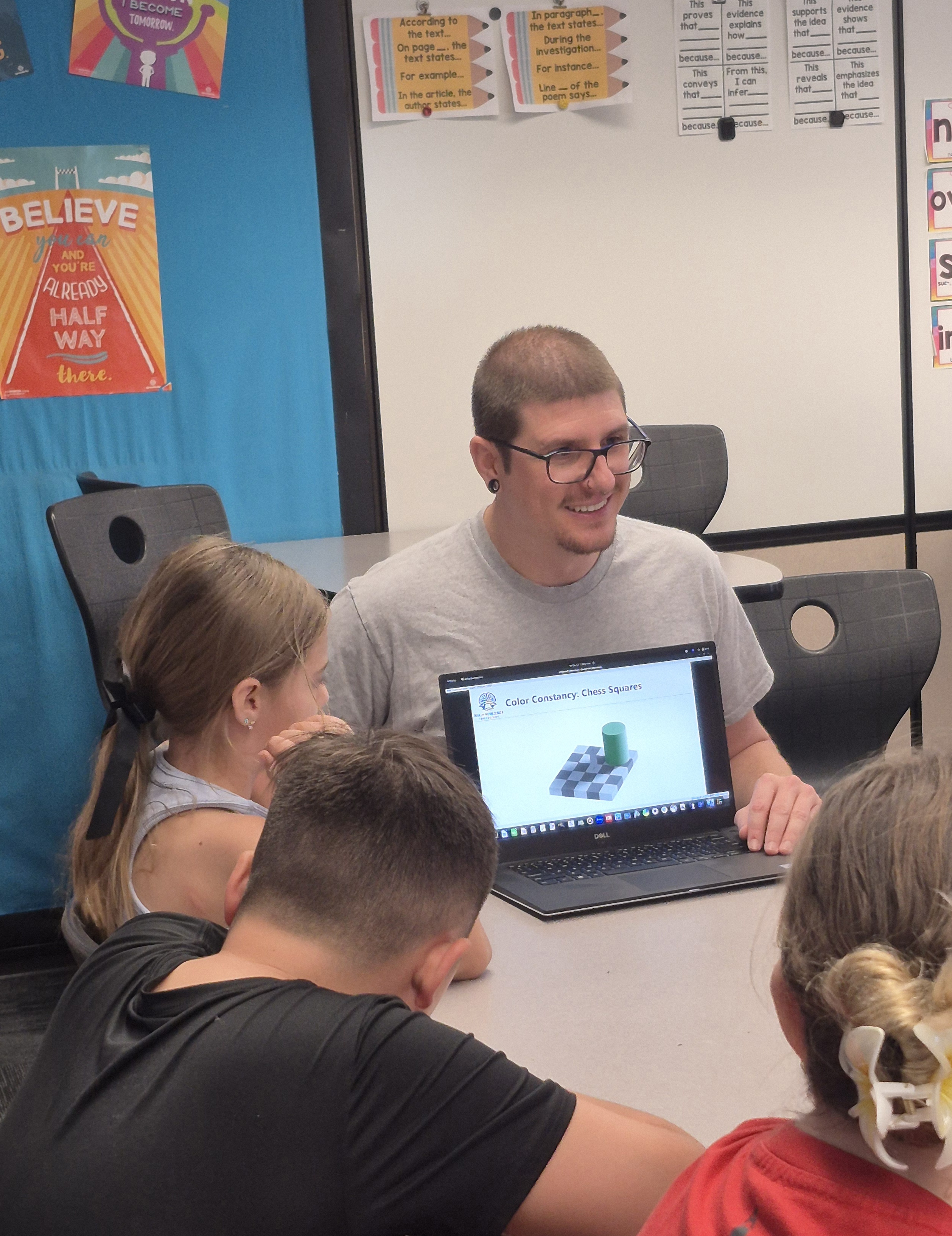 Dr. Hasselmann showing an illusion on his laptop to students